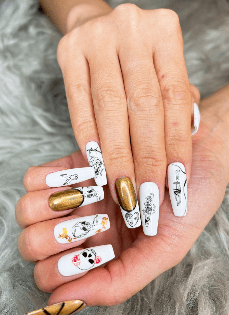 White and gold Artistic Trendz nail art on both hands