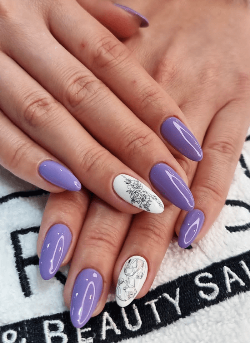 Purple manicure with white floral accent nails