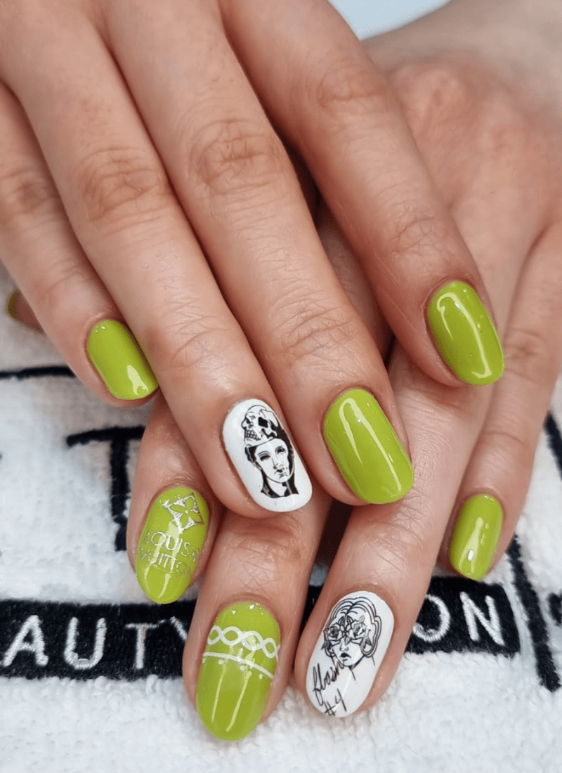 Green manicure with monochrome portrait accent nails